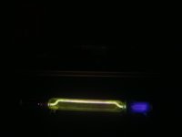 Nice glowing Geissler tube in the dark (click to enlarge)