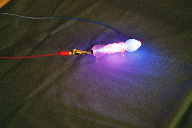 Tube with an outer tubing filled with a red fluorescent liquid (click to enlarge)