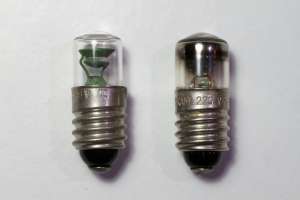 Picture of two glow lamps: the one on the left is new and the one on the right has several years of service. (click to enlarge)