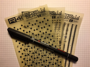 Picture of some (old) letter transfer sheets and a permanent marker (click to enlarge).